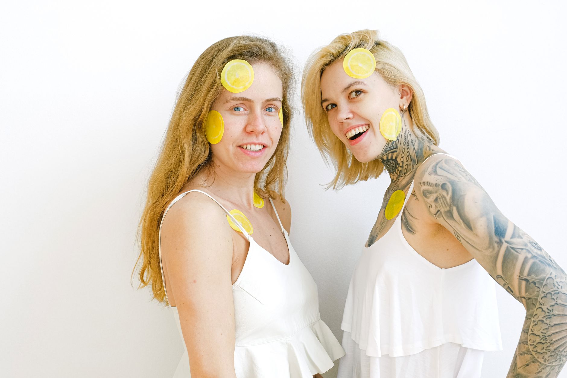A yellow silicone vibrator surrounded by fresh bananas on a bright yellow background, representing pleasure and vitality